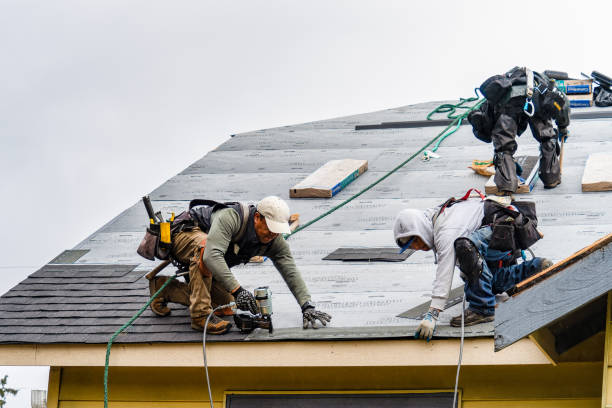 Professional Gutter Installation technician working in Wellsville, MO